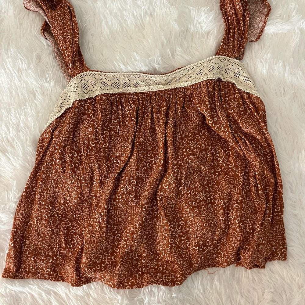 Burnt orange tank with white tribal design